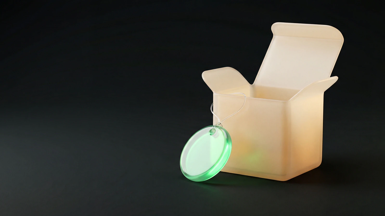 An open frosted opal-glass sample box with a green liquid-glass gift tag, representing product seeding and influencer gifting with no hidden posting obligations.